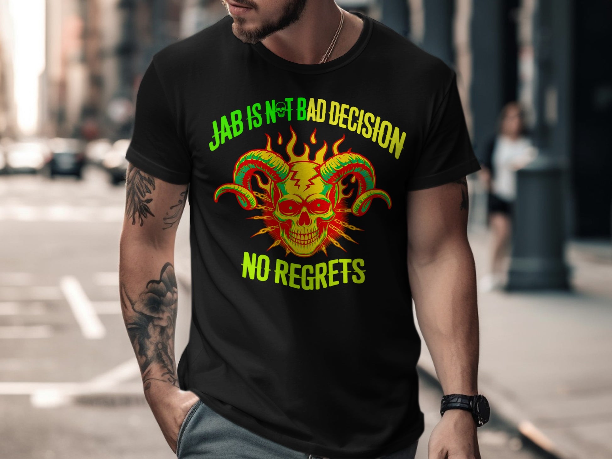 Black t-shirt with green and yellow text and a red skull with horns graphic.