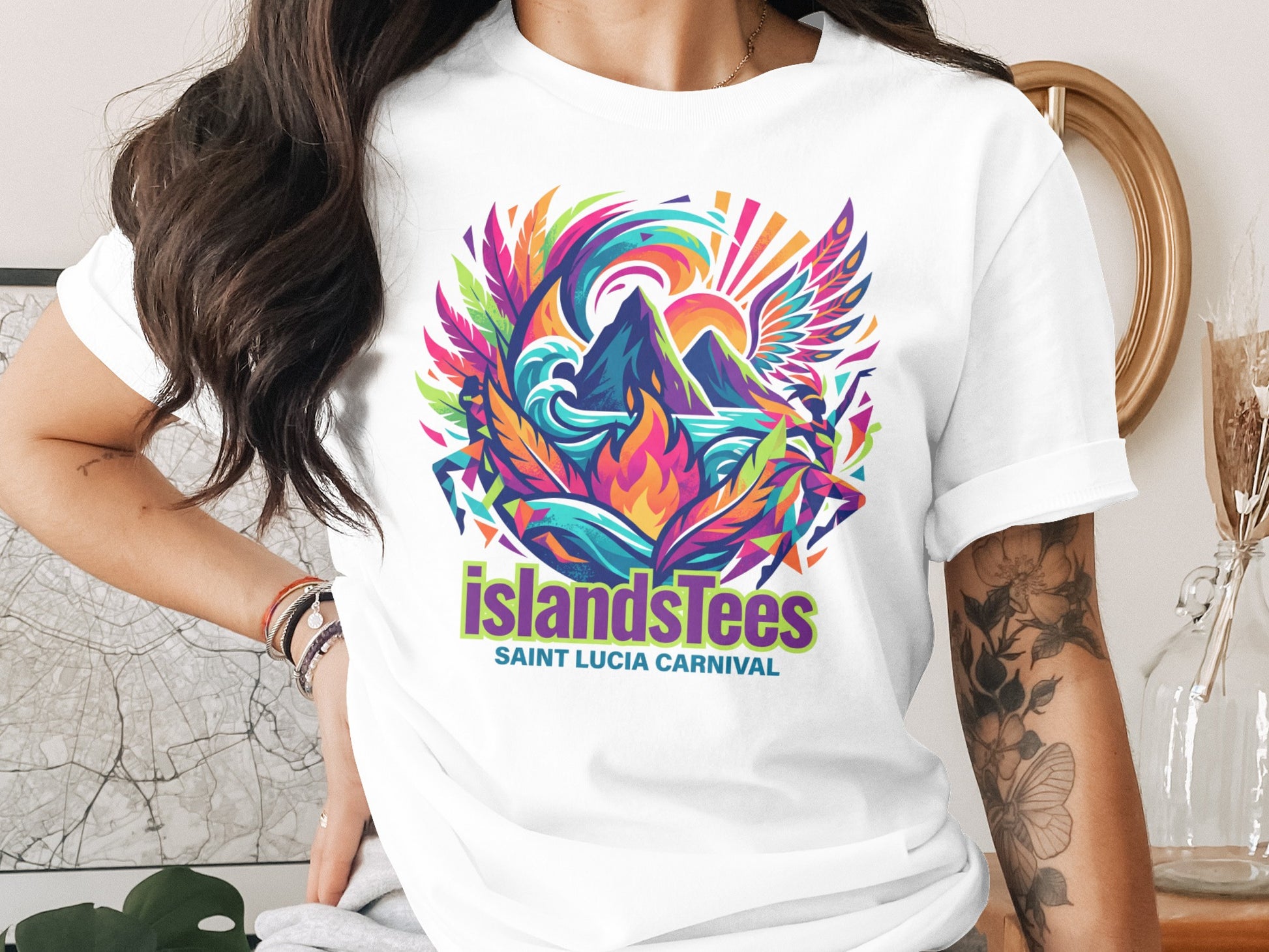 T-shirt featuring vibrant IslandsTease Saint Lucia Carnival graphic with winged figures.