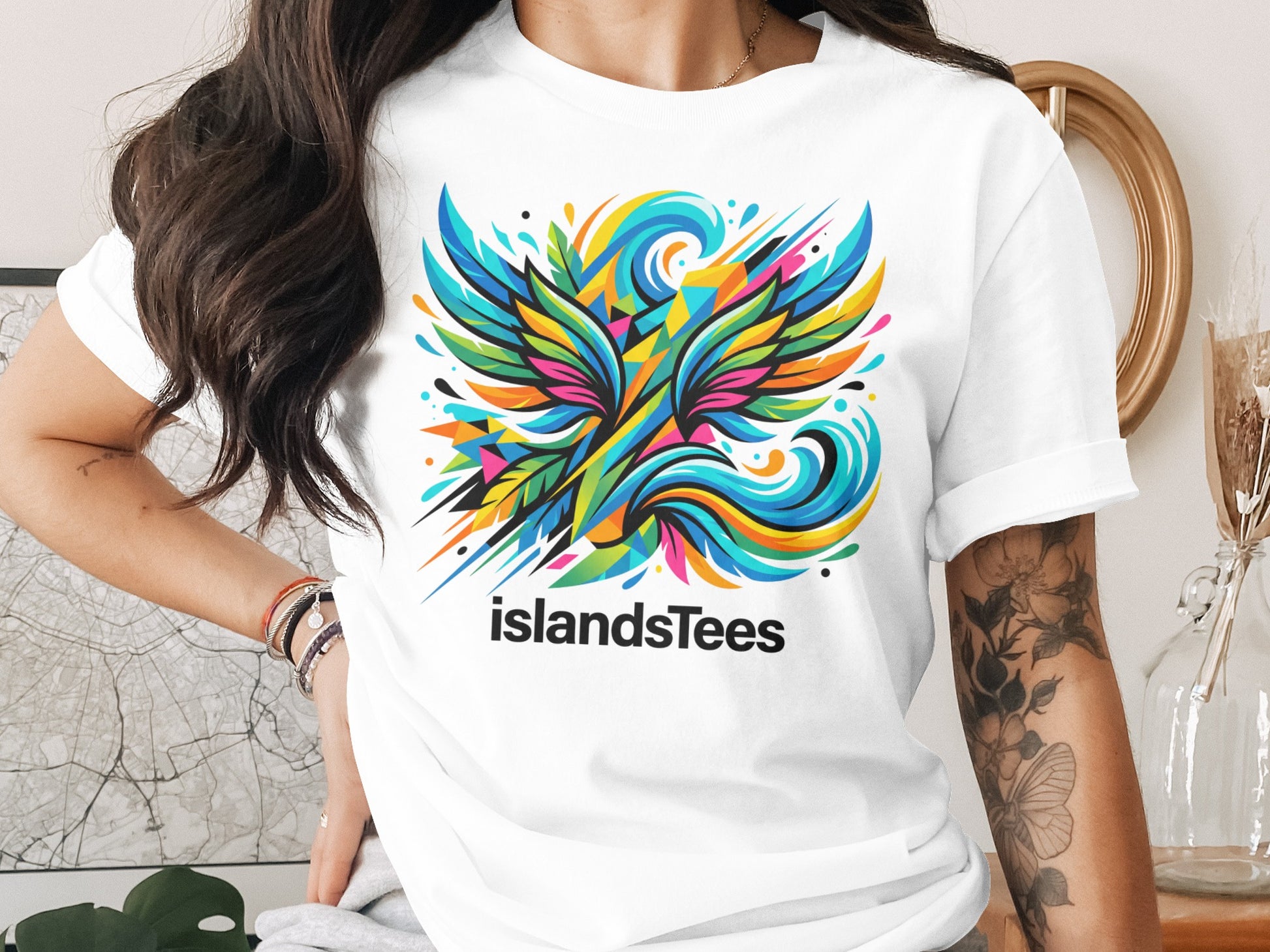 Colorful abstract bird design on a white t-shirt.