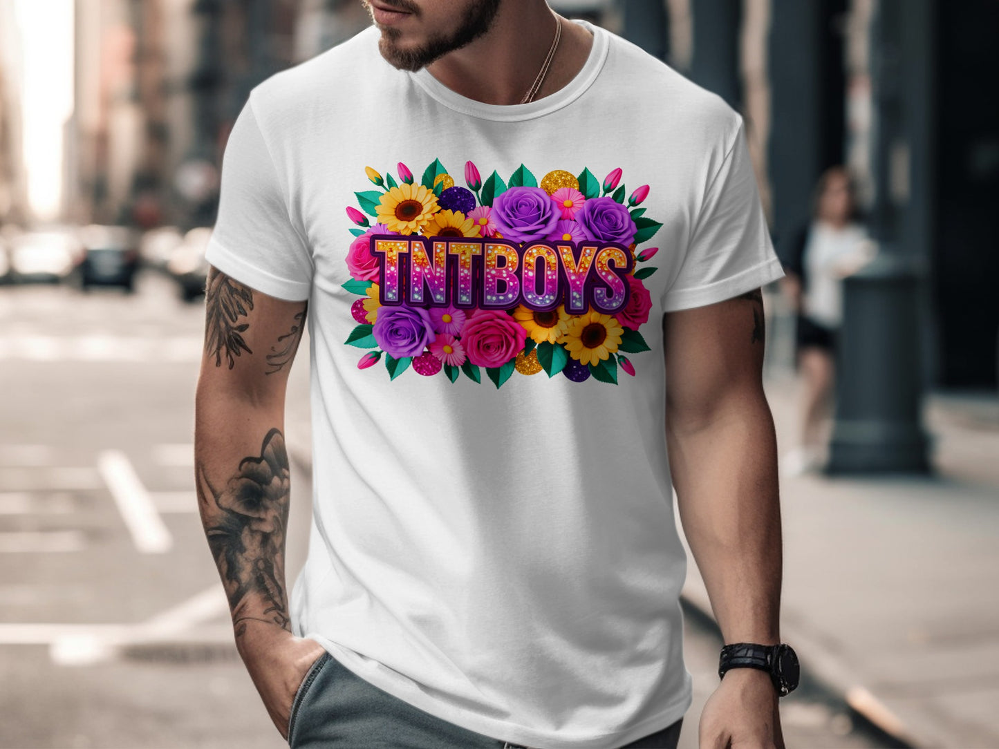 Tntboys logo with colorful flowers and glitter on a white t-shirt.