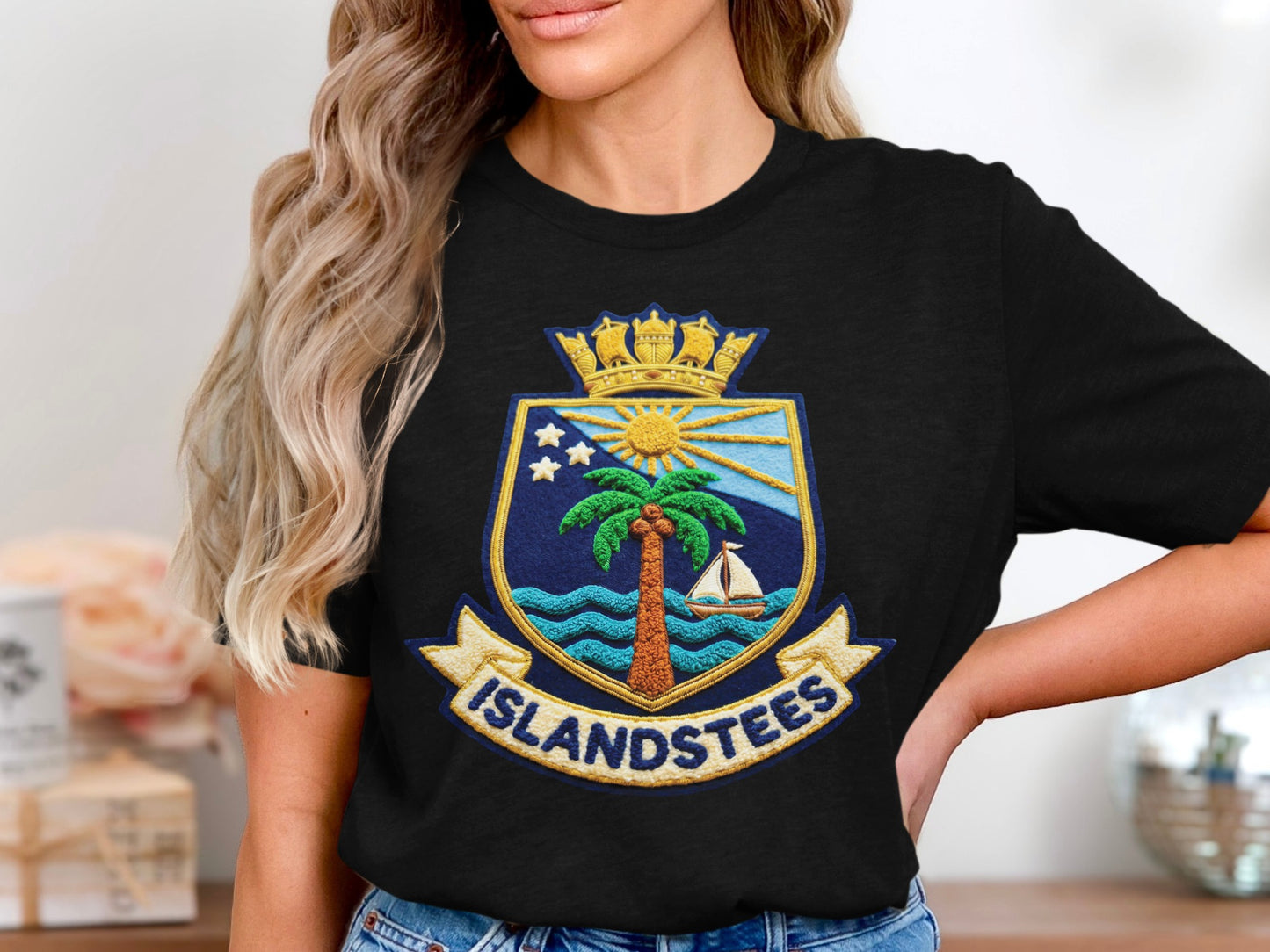Black t-shirt featuring a crest with palm tree, sun, and "ISLANDSTEES" text.