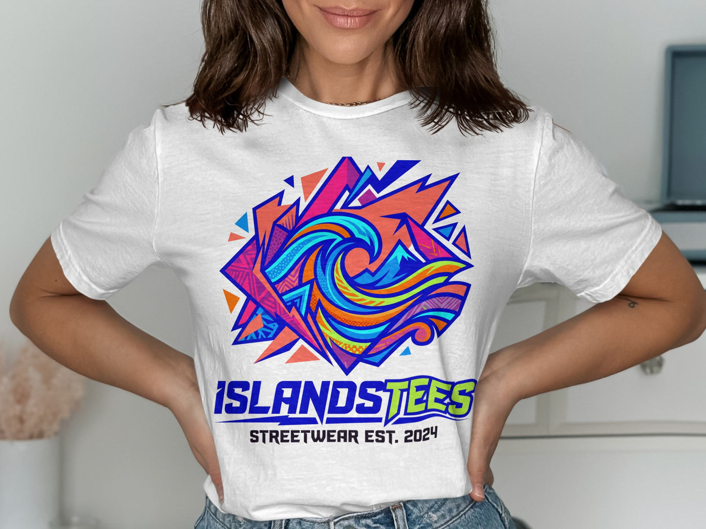 White t-shirt with colorful geometric wave graphic and "ISLANDSTEES STREETWEAR EST. 2024" text.
