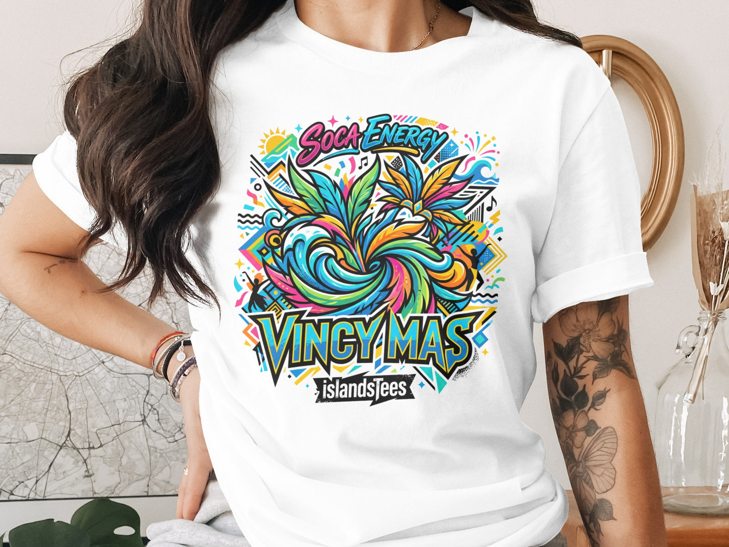 White t-shirt with colorful "Soca Energy Vingy Mas IslandsTees" graphic design.